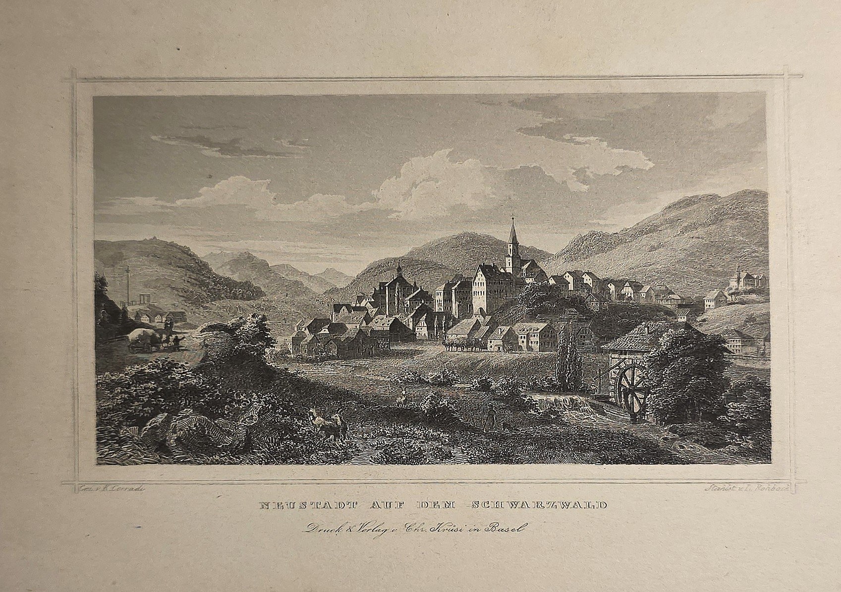 Ortschaft in weiter Berglandschaft