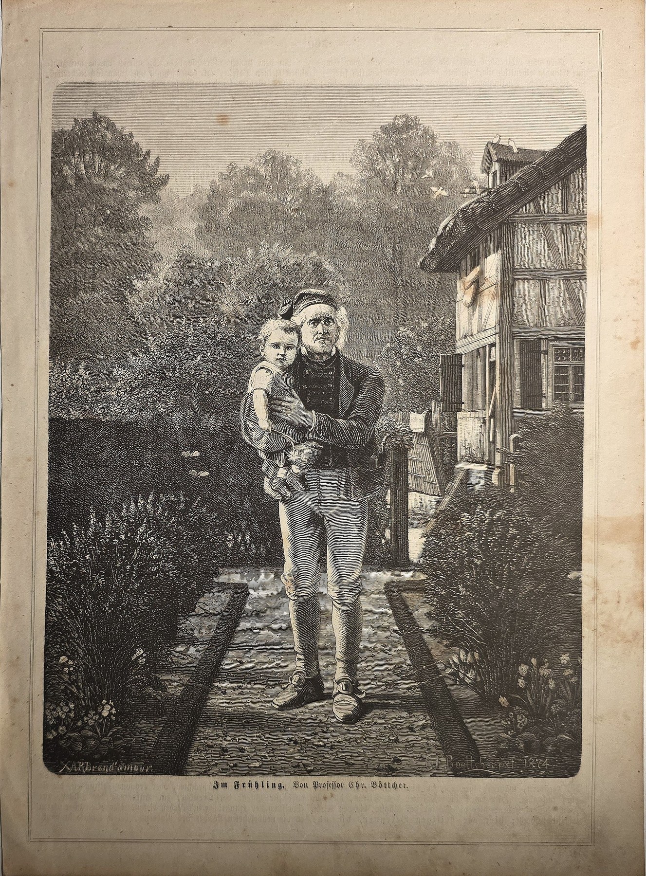 Junger Mann auf Gartenweg vor Fachwerkhaus