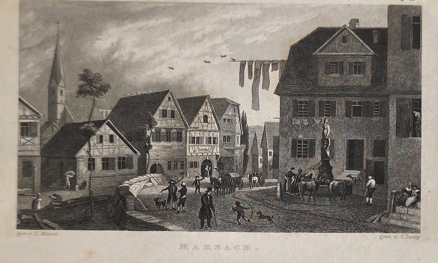 Belebte Dorfstraße mit Fachwerkhäusern