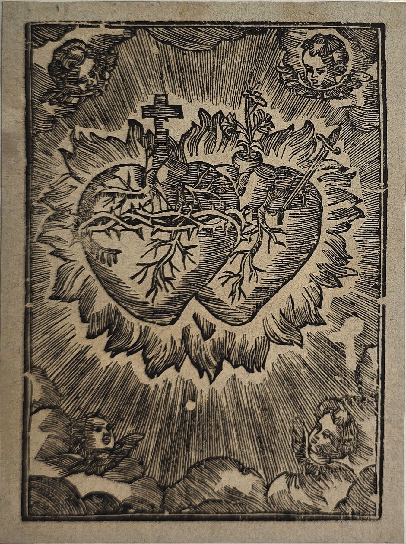 Herzsymbol mit Kreuz und Dornenkranz