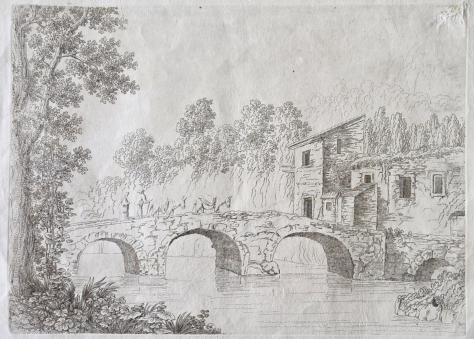 Steinbrücke mit Haus in bewaldeter Landschaft