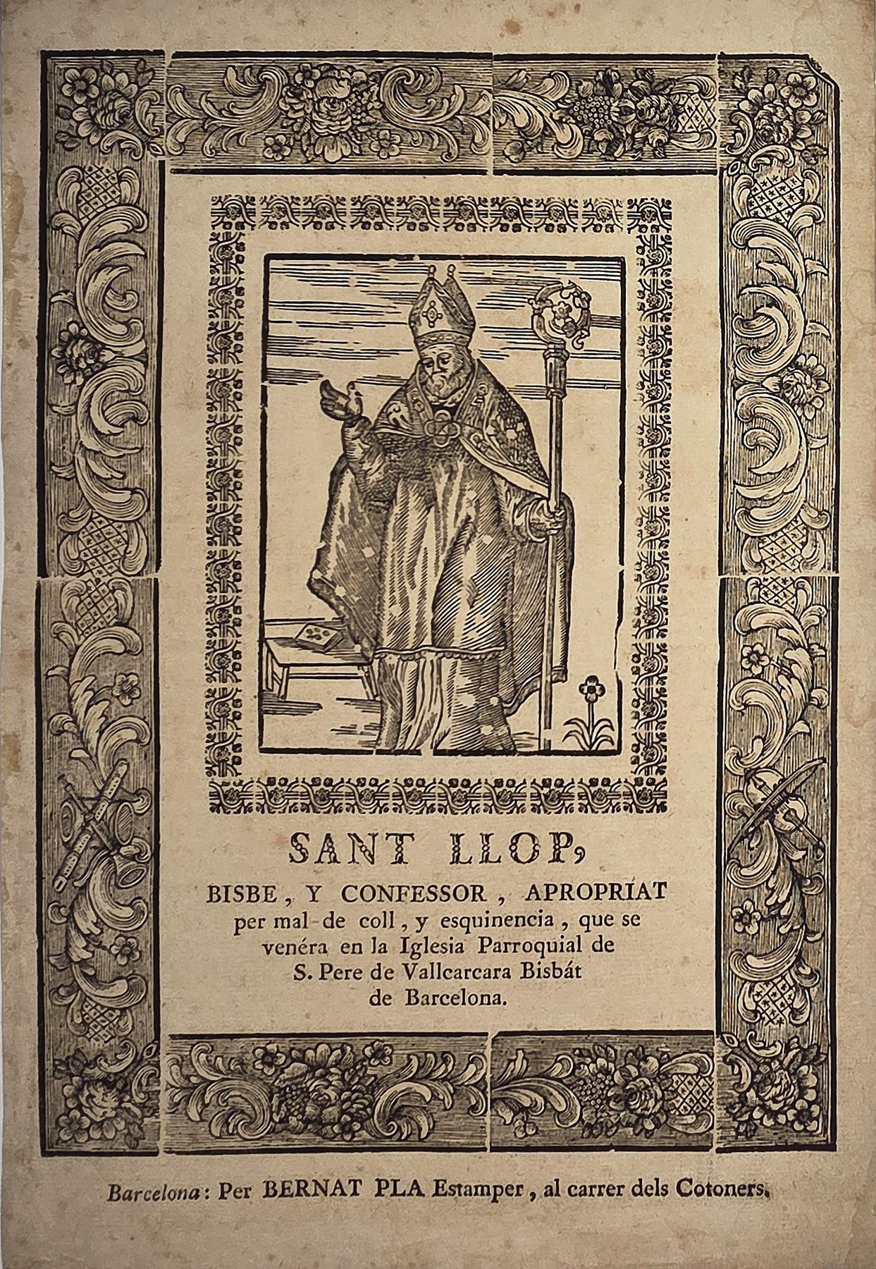 Sant Llop – Heiligenfigur im reich ornamentierten Rahmen