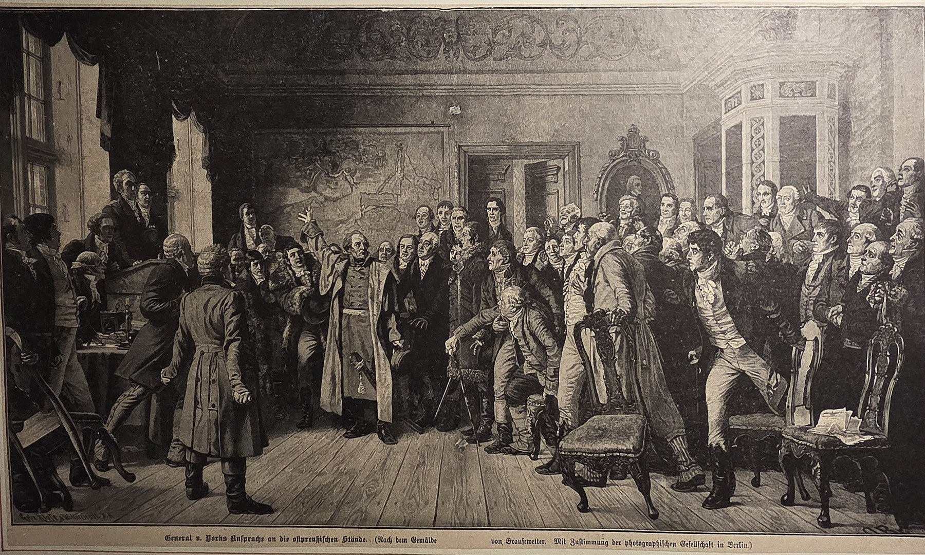 Gesellschaftliche Szene in dicht besetztem Saal